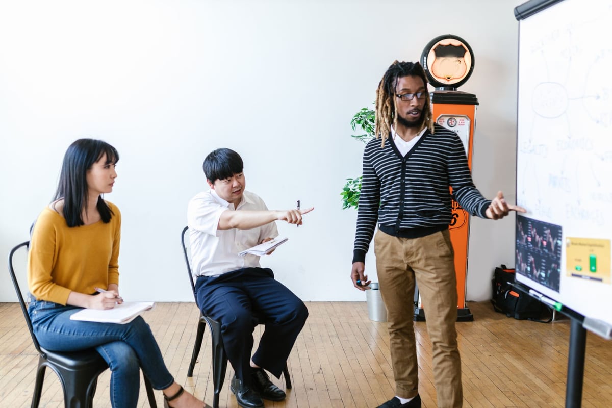 A facilitator leading an interactive community workshop